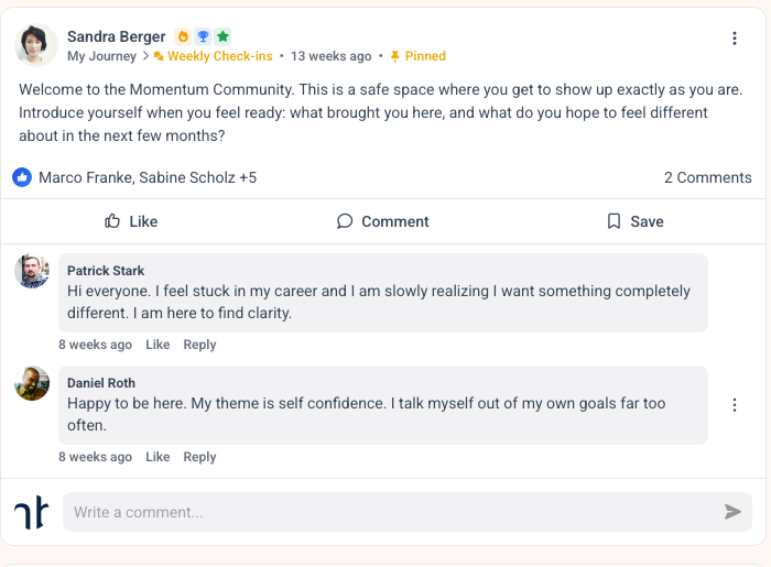 Community post in MemberArea with reactions, comment count and two member replies below it